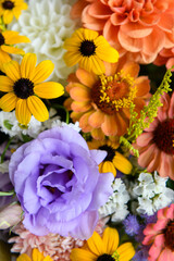 Summer bouquet. Beautiful orange, yellow and lavender fresh flower arrangement. Birthday or weddding bouquet made of summer flowers close up.