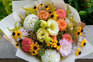 Summer bouquet. Beautiful white and salmon orange fresh flower arrangement. Birthday or weddding bouquet made of summer flowers.