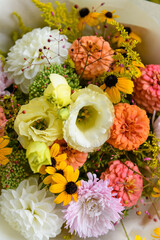 Summer bouquet. Beautiful white and salmon orange fresh flower arrangement. Birthday or weddding bouquet made of summer flowers.