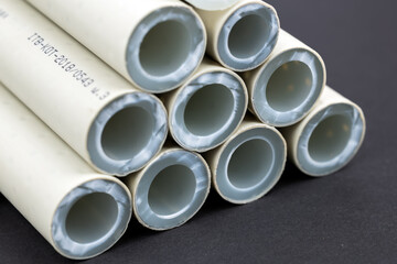 Fototapeta premium Various polypropylene pipes for soldering on dark