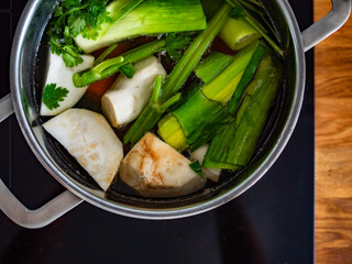 Cooking broth - vegetables in cooking pot. Top view