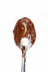 Cream chocolate with spoon on a white background