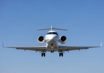 Obraz premium Private jet approaches for landing against a clear blue sky on a sunny afternoon