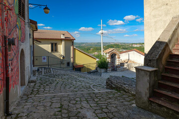 A narrow street among the old houses of Montefalcione, a village in the province of Avellino, Italy.