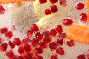 Various fruits in ice. Cold drink.
