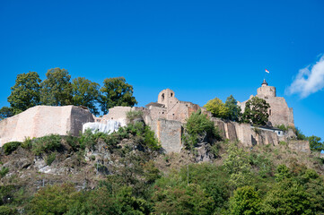 Saarburg mediaeval castle, riverbank of Saar river, cityscape on hill cliff, Rhineland Palatinate, Germany