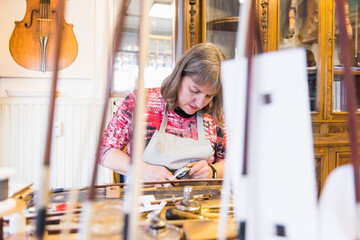 Female violin maker at work