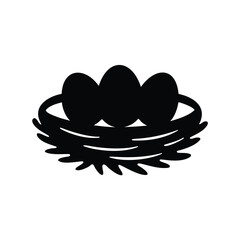 Black silhouette of bird nest with three eggs, representing springtime and nature