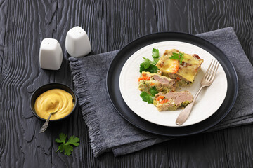 Cheesy ground meat vegetables casserole on a plate