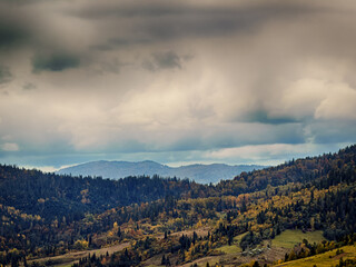 Misty Autumn Rain Clouds over Ukrainian Carpathian Mountains.