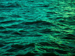 Turquoise Green Ocean Water Waves Surface with Golden Light Reflection - Tropical Sea Texture Background Pattern