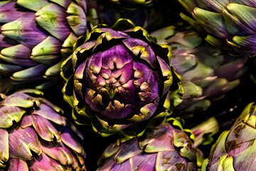 Close Up of Fresh, Vibrant Artichokes in Market Setting with Captivating Purple Hues and Textures