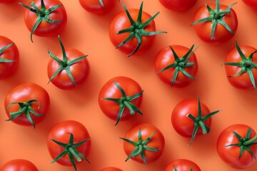 Fresh Round Tomatoes Arranged in Neat Pattern Display on a Bright Orange Surface for Healthy Eating