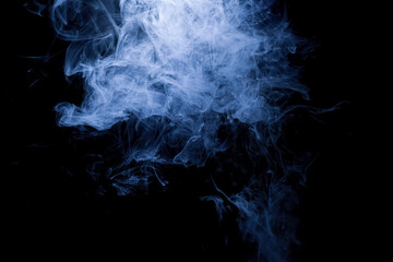 Abstract smoke rising gracefully, creating a dark and dramatic background.