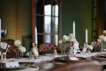 Elegant dining setup with candles and flowers, perfect for a special occasion or gathering