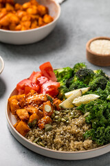 Vibrant vegan buddha bowl with quinoa, roasted vegetables, and fresh greens. Vegetable recipes.