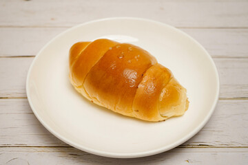 (Shio Pan) Japanese style salt bread that is characterized by its crispy exterior and soft, buttery interior.
