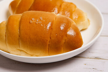 (Shio Pan) Japanese style salt bread that is characterized by its crispy exterior and soft, buttery interior.