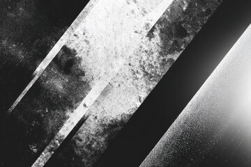 Abstract grayscale composition featuring diagonal shapes with varying textures and contrast