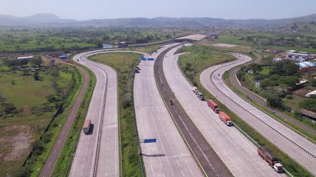 Igatpuri Interchange on Samruddhi Mahamarg through green corridors western ghats landscape, Igatpuri Kasara tunnel in background, Maharashtra, drone shot