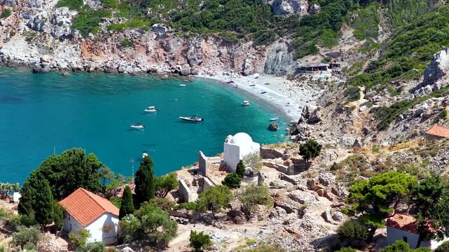 Aerial view of the ruins of the byzantine castle at Kastro, Skiathos island, Greece, with the beautiful beach and turquoise sea at the bay