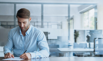 Business entrepreneur sitting at table signing contract at meeting or writing test on interview. Young man client or intern manager worker writing on paper with pen in office. Web banner, copy space © Stock 4 You