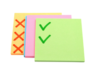 Four colorful sticky notes featuring checkmarks and crosses, representing tasks and organization.