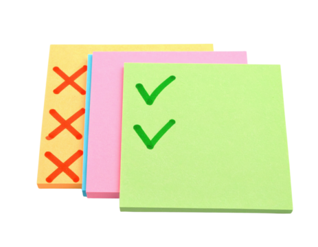 Four colorful sticky notes featuring checkmarks and crosses, representing tasks and organization.