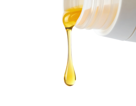 A bottle is pouring a golden-yellow liquid, which drips down in a smooth, continuous stream.