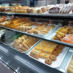 Diverse Indonesian Traditional Pastries and Snacks in Bakery Display