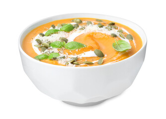 Delicious pumpkin soup with spices, cheese and sour cream in bowl isolated on white