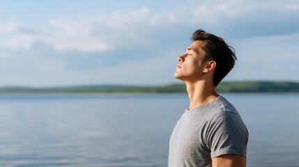 Man Practicing Deep Breathing by Lake with Nature Backdrop