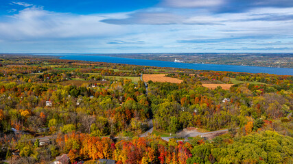 Trumansburg, NY, USA - October 17, 2025:  Aerial photo over the Village of Trumansburg, NY with view of Cayuga Lake
