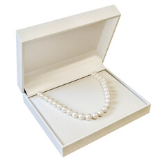 Elegant white pearl necklace displayed in premium box, isolated on white