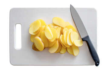 Sliced potatoes on a prep board with a kitchen knife, isolated on white