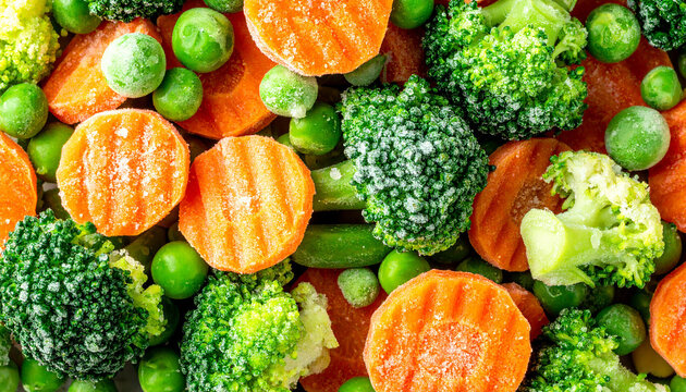 Frozen mixed vegetables, green peas, broccoli florets and carrot slices, frost and ice crystals