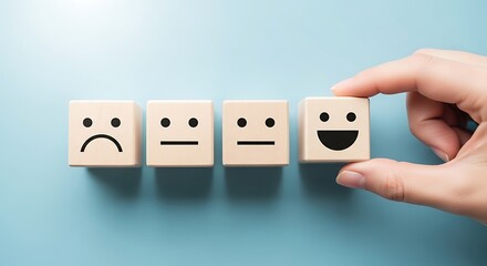 Customer satisfaction survey with wooden blocks showing different emotions from sad to happy