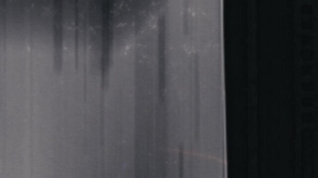 Grungy, vintage microfiche-style transitions for dynamic video edits. Ideal for historical or technological themes