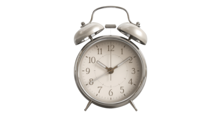 Classic vintage silver alarm clock showing time symbolizing punctuality, morning routine, schedule and timeless retro design concept isolated on white background
