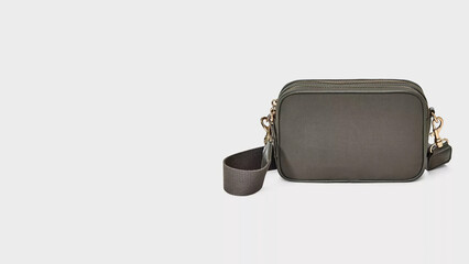 Stylish grey crossbody bag with adjustable strap suitable for daily use or casual outings.