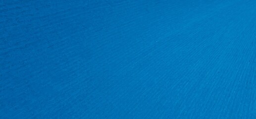 scratched blue metal sheet with visible texture. background