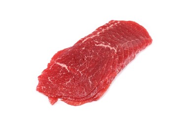 Thin slices of beef carpaccio on white background. It is an italian dish served raw.