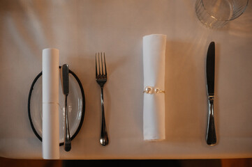 Elegant Table Setting with Rolled Napkin and Cutlery