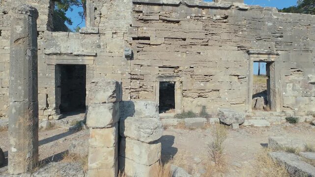 Aerial fpv drone footage flying through the ancient city ruins of Lyrbe, Antalya, Turkey