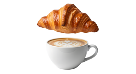 Freshly baked golden croissant floating above a white ceramic cup of cappuccino with latte art isolated on transparent background