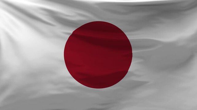The Japan flag is waving in the wind.