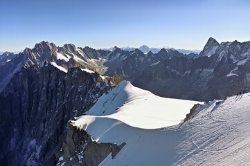 Mountaineers Climb Over Snowcovered Ridge