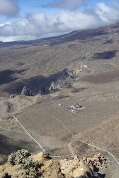 Panorama during the ascent to Alto de Guajara, 2715m, to the bizarrely shaped rock formations of volcanic rock, Roques de Garc&iacute;a, the visitor centre and the Hotel Parador, at sunrise, Teide National Park, Parque Nacional del Teide, Tenerife, Canary Islands, Spain