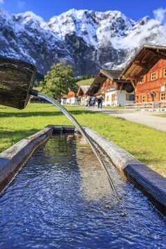 Fountain, snowy mountains, alpine pasture, autumn, maple trees, sunny, Engalm, Gro&szlig;er Ahornboden, Karwendel Mountains, Tyrol, Austria