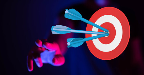 Arrows striking the bullseye represent a perfect goal.  Hand reaching for the target. Success...